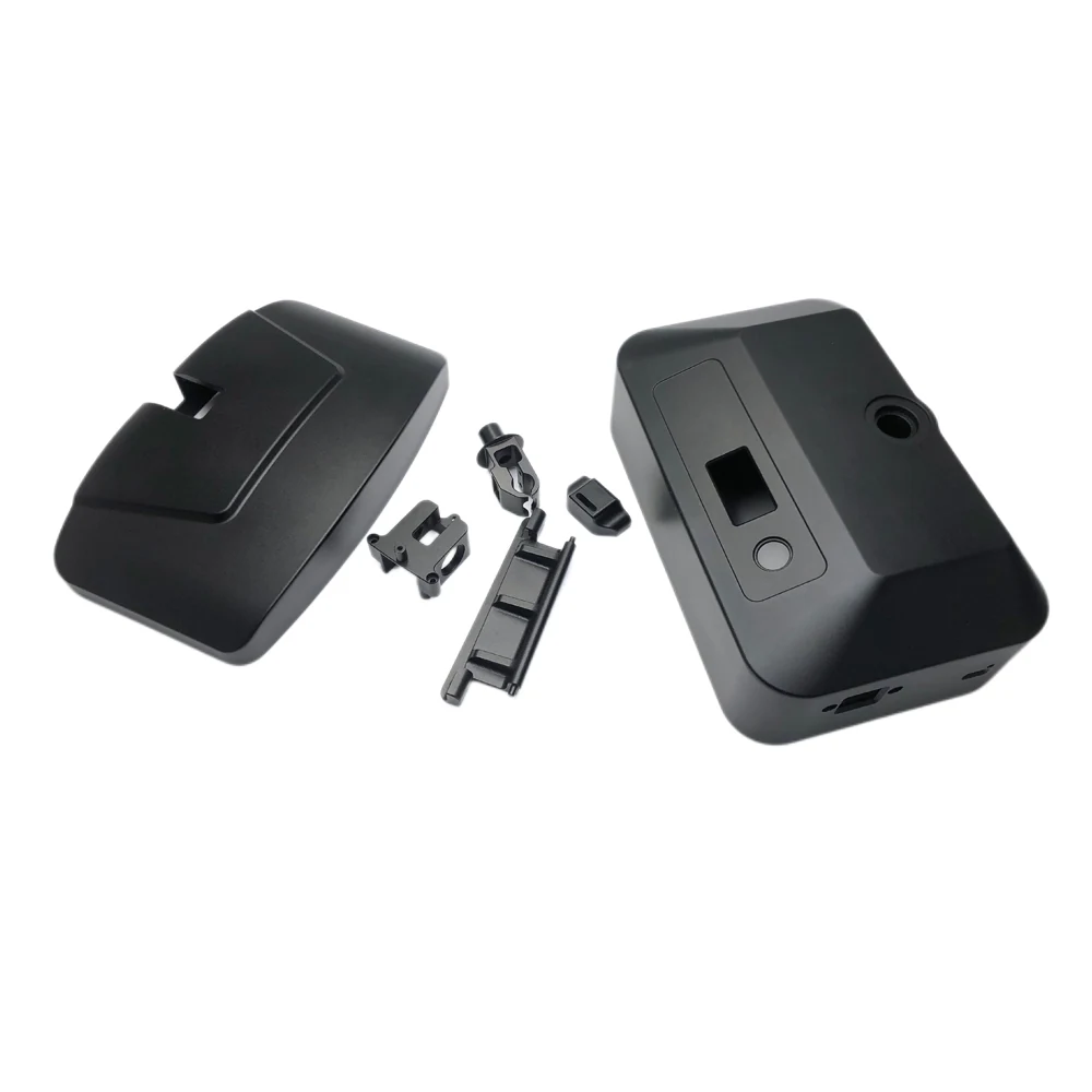 Black machined enclosure covers with recessed panels and circular and rectangular openings